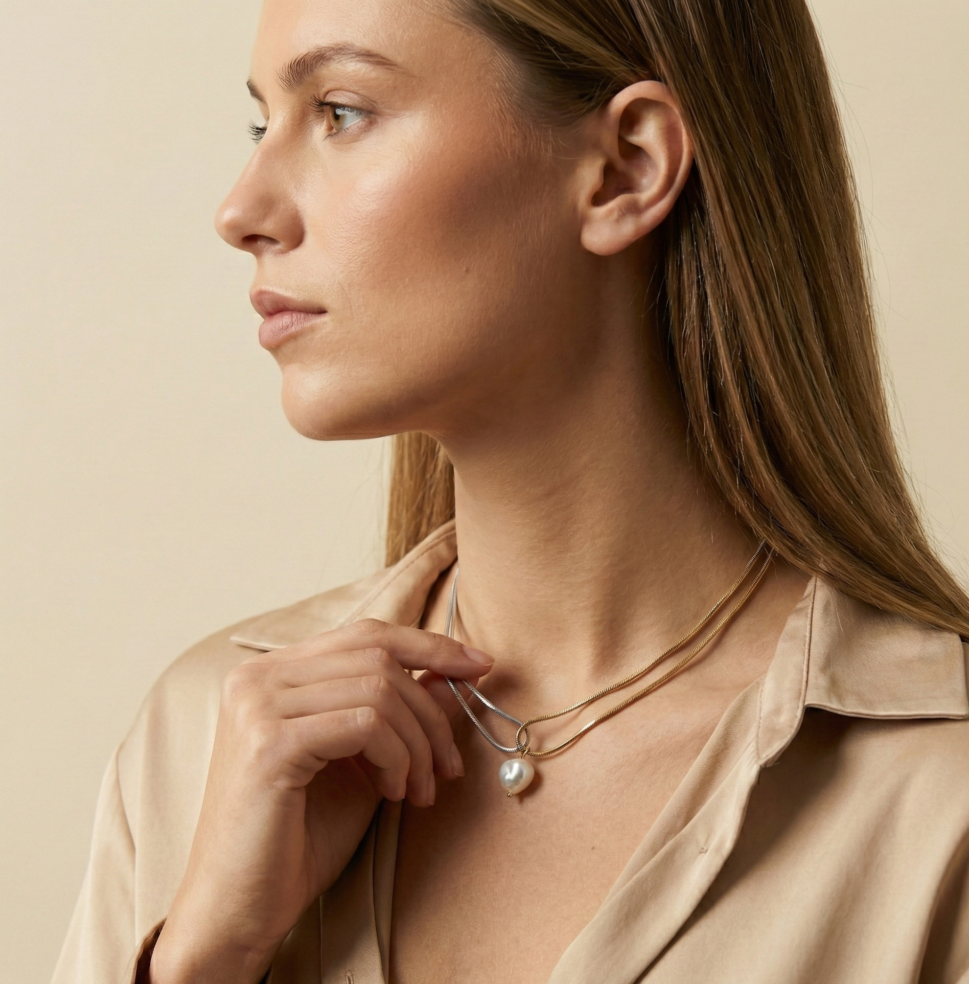 double-strand silver gold snake chain necklace featuring a single lustrous white baroque pearl pendant
