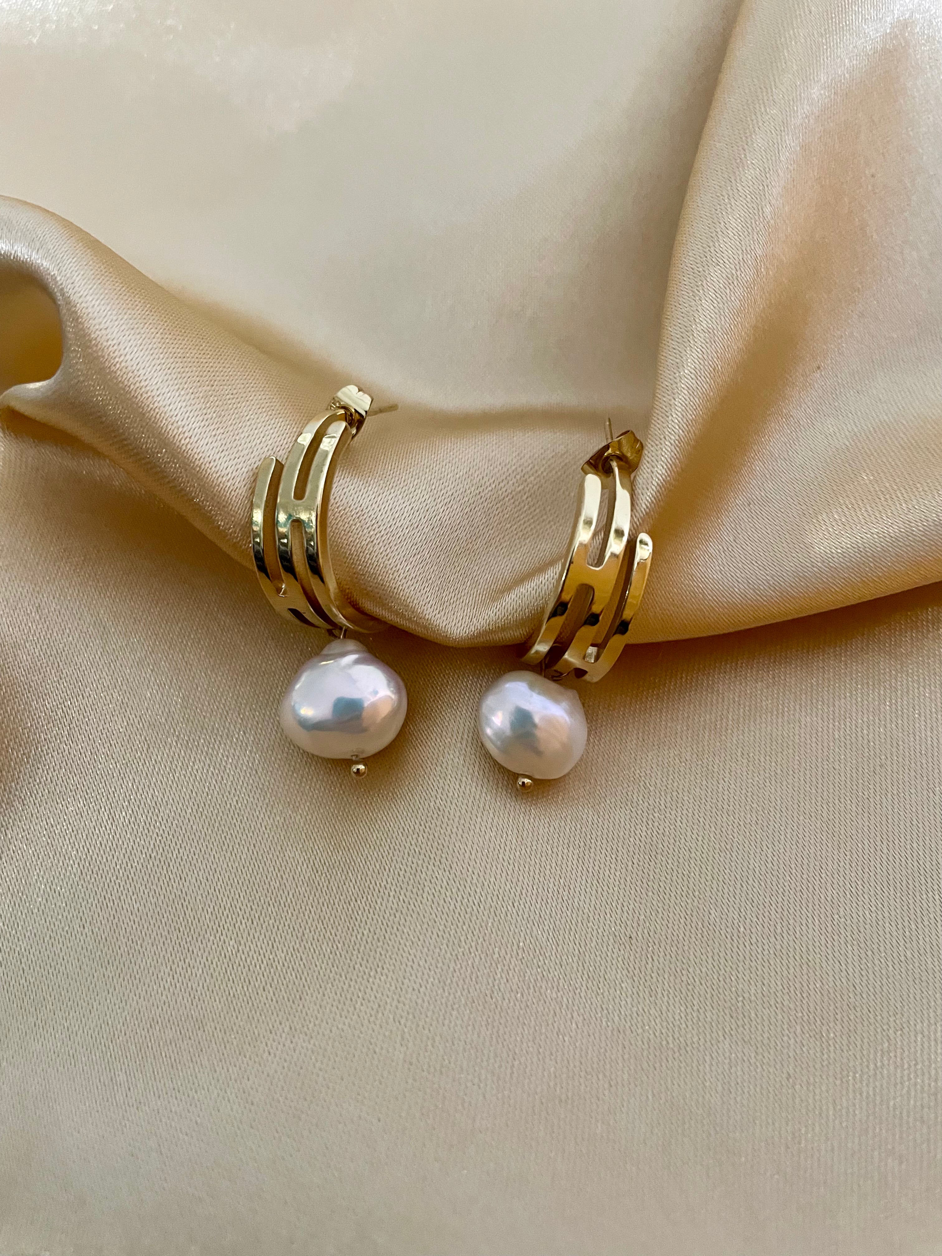 lustrous baroque freshwater pearls suspended from sleek polished hoops