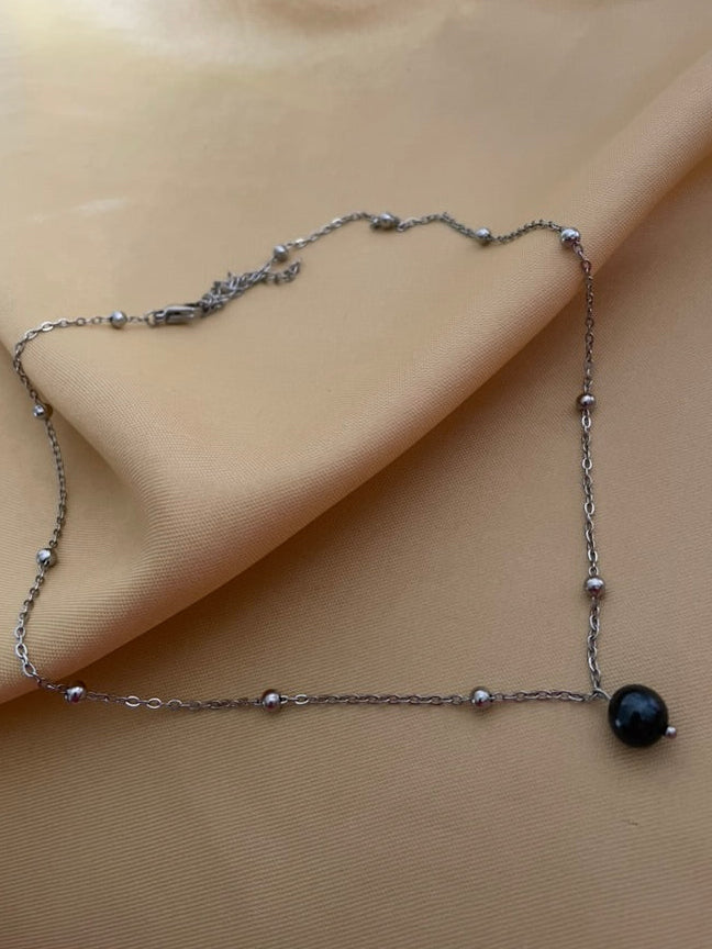 Necklace with a black pearl on a silver beaded chain