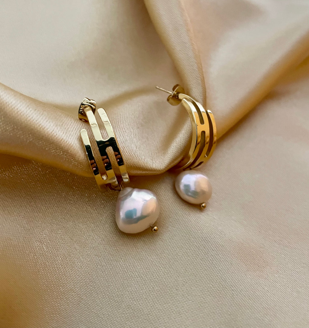lustrous baroque freshwater pearls suspended from sleek polished hoops
