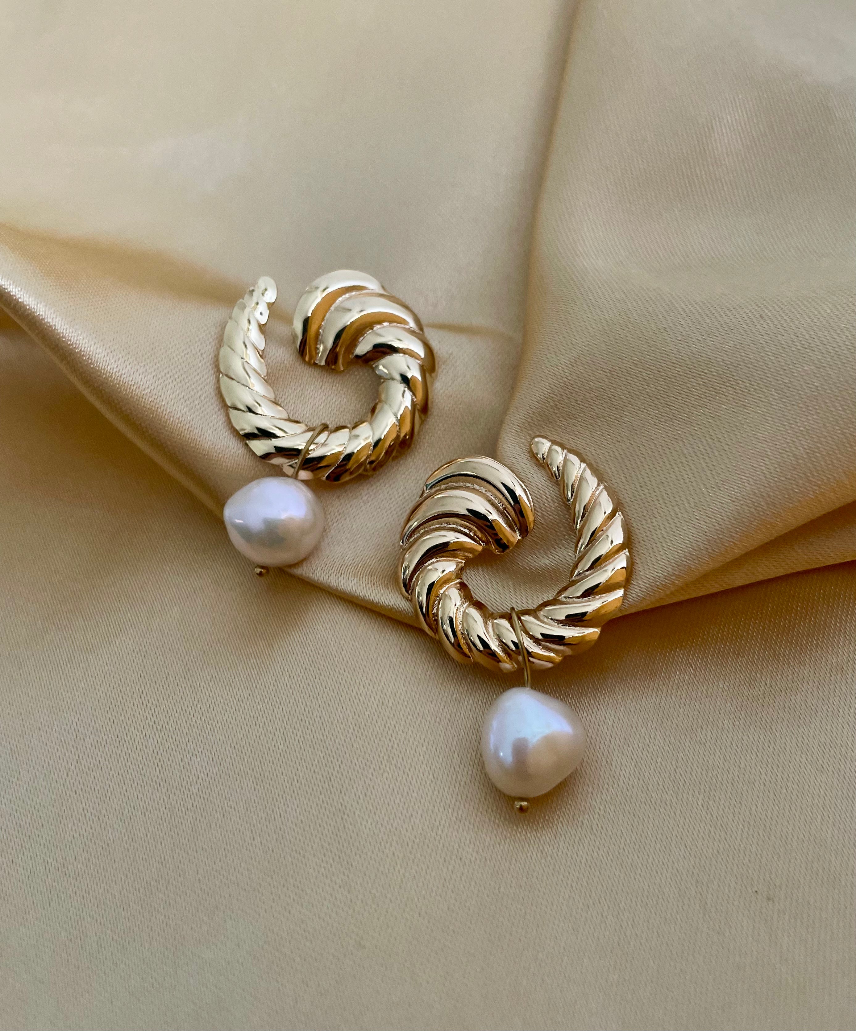 Close-up detail of the ribbed gold texture on the Miranda croissant hoops paired with a high-lustre AAA white baroque pearl.