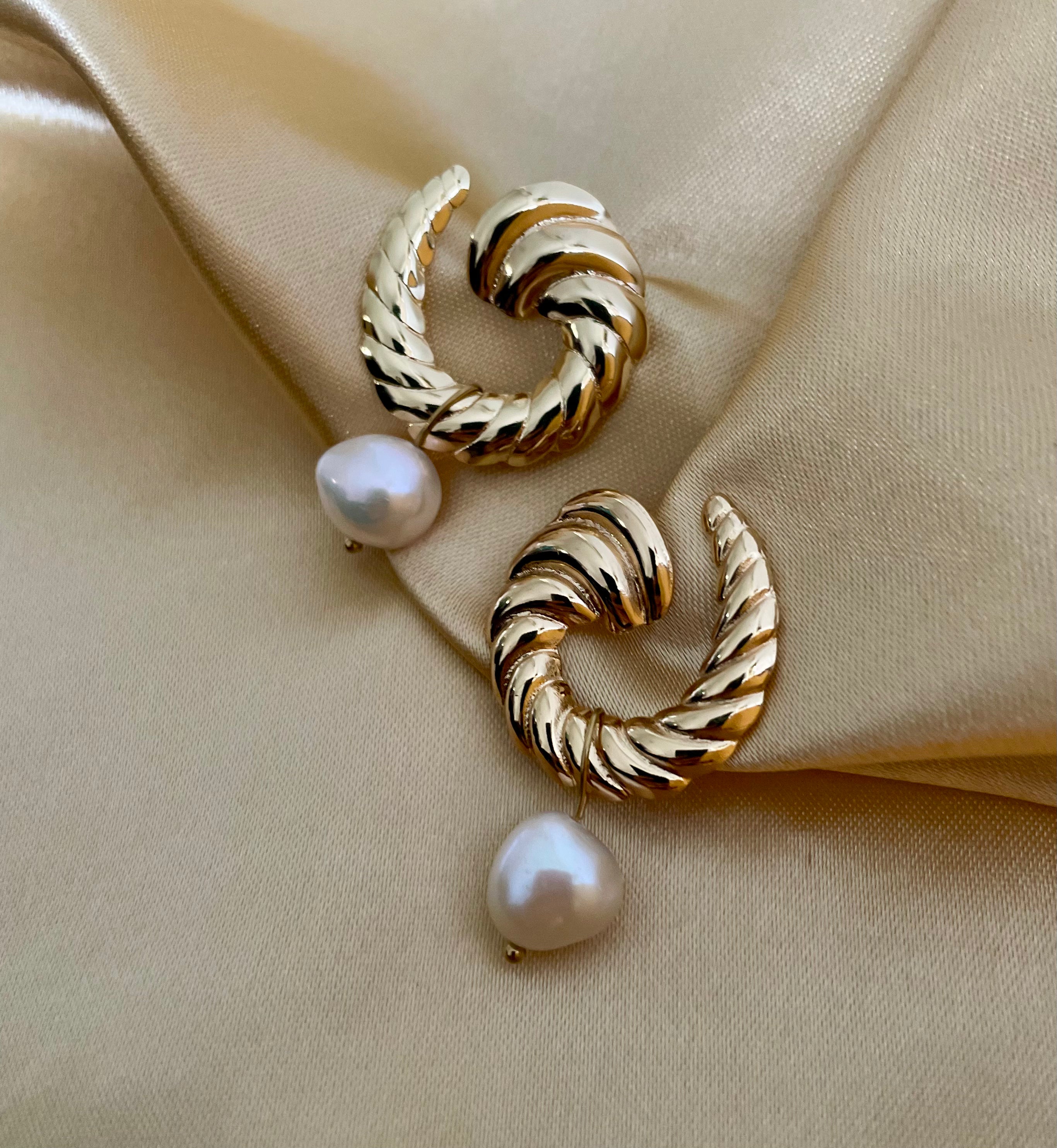 Miranda earrings featuring a textured 2.5cm gold croissant hoop with a dangling 1cm white baroque freshwater pearl. Modern 18k gold plated stainless steel jewelry